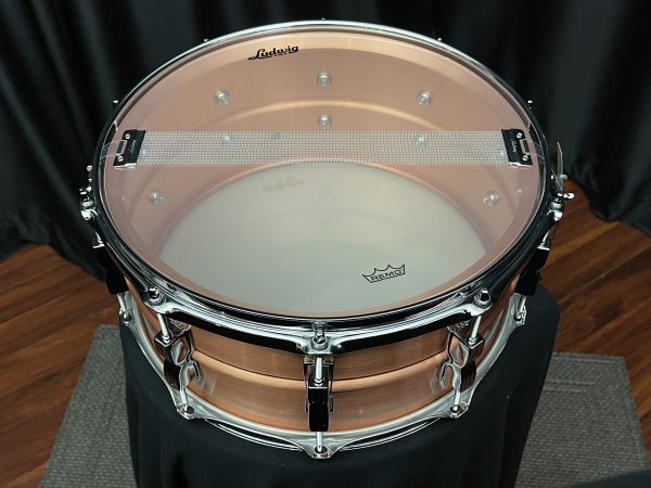 Ludwig brushed copper acro six point five by fourteen inch snare drum inside