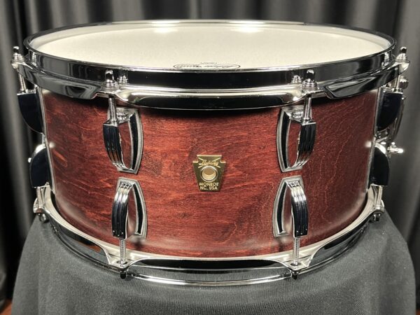 Ludwig USA Classic Maple 6.5x14 8-Lug Snare. dark walnut appearance with chrome shell hardware. 8 lugs at top and 8 lugs at bottom. cast brass ludwig keystone badge