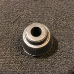 Tama 6564RT Vintage Spur Tip. conical black rubber tip with hole in center. approximately 2in. diameter. grooves on bottom