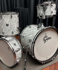 Gretsch Model: CT1-J484-WSF catalina club jazz 4 piece drum set with chrome shell hardware. 12 tom 14 floor tom with legs 18 bass drum with tom holder 14 snare drum. white satin flame swirled textured finish