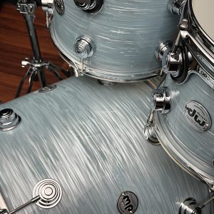 Close up of toms and bass drum on DW Collector's Series Maple Mahogany 4pc set in Pale Blue Oyster