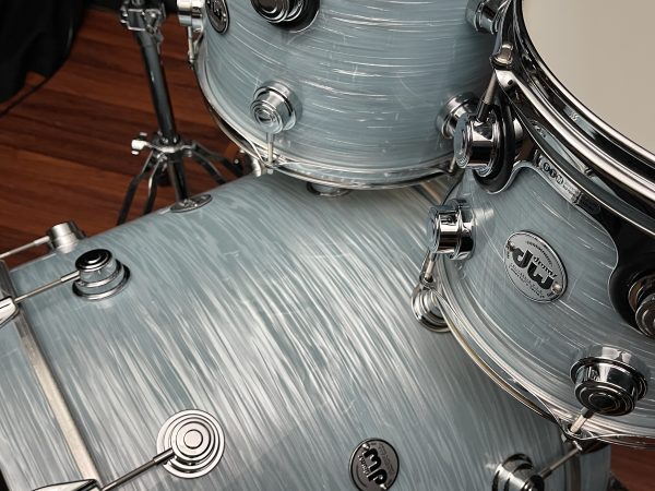Close up of toms and bass drum on DW Collector's Series Maple Mahogany 4pc set in Pale Blue Oyster