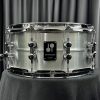 Sonor Kompressor Series six point five by fourteen aluminum shell snare drum from front showing badge