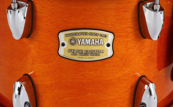Yamaha 5 piece Stage Custom Birch set in Honey Amber. 10, 12, 14 floor tom, 20 bass, 14 snare. Close up finish