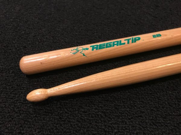 Regal tip wood drumsticks in two bee size with wood tips and green silkscreen logo