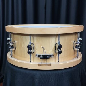 Pacific drum company six point five by fourteen inch concept maple snare drum with maple counterhoops in a natural maple finish snare butt