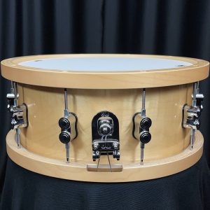 Pacific drum company six point five by fourteen inch concept maple snare drum with maple counterhoops in a natural maple finish mag throw off