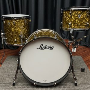 Front view of Ludwig butterscotch Pearl Neusonic three piece drum set eight by twelve tom fourteen by fourteen floor tom and fourteen by twenty bass drum
