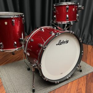 Ludwig U S A red sparkle fab set with thirteen inch tom, sixteen inch floor tom, and twenty two inch bass drum front side view