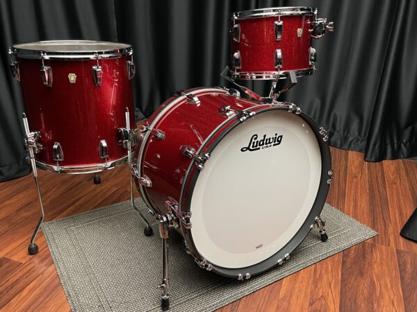 Ludwig U S A red sparkle fab set with thirteen inch tom, sixteen inch floor tom, and twenty two inch bass drum front side view