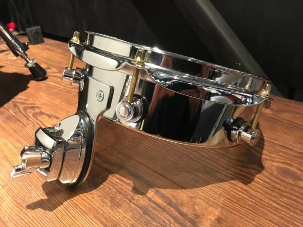 Used DW eight inch chrome steel piccolo tom chrome showing other side