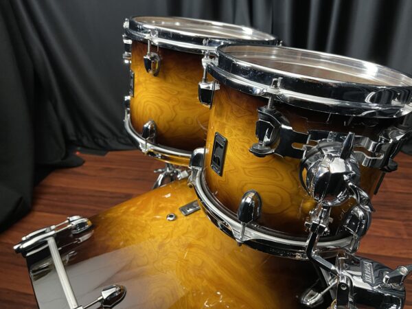 Mounted Toms and Bass of Used Mapex Black Panther Velvetone Five Piece Set in Butter Burl Burst Lacquer Finish