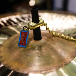 No Nuts Brass Colored Cymbal Chain For Sizzle Effect Shown on Black No Nuts Sleeve